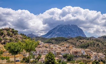 A Mountain Under Cloudy And Blue Sky