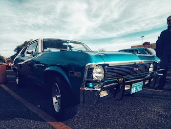 A Parked Classic Blue Chevrolet Camaro Ss Coupe