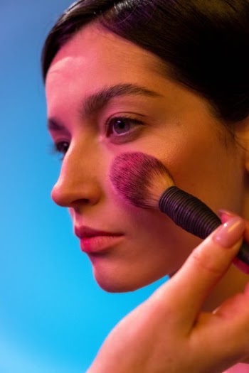 A Person Applying Makeup to a Woman's Face · Free Stock Photo
