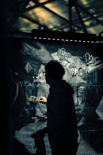 A Person Painting a Mural