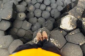 A Person Standing On A Concrete Floor