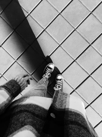 A Person Wearing a Converse · Free Stock Photo