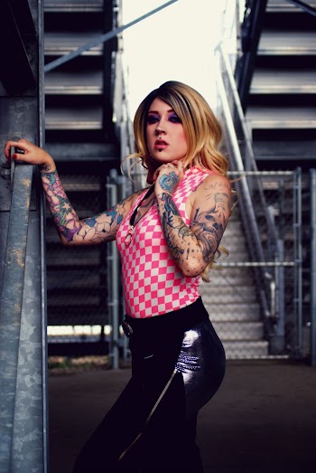 A Photo Of A Woman With Arms Tattoo 
