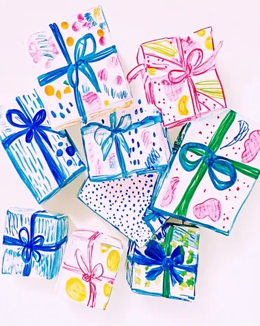 a pile of wrapped presents sitting on top of a table a pile of wrapped presents sitting on top of a table