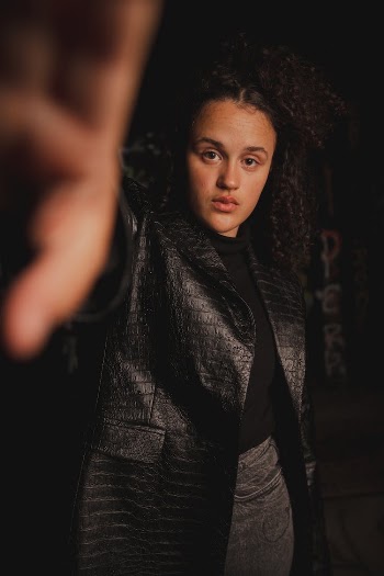 A Portrait of a Woman in a Black Coat
