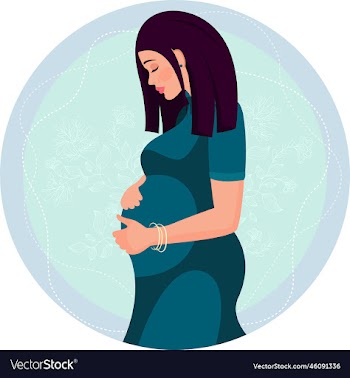 a pregnant girl in a dress hugs her belly