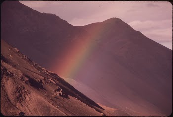 A Rainbow Seems Rooted in a Rock | Free Photo - rawpixel
