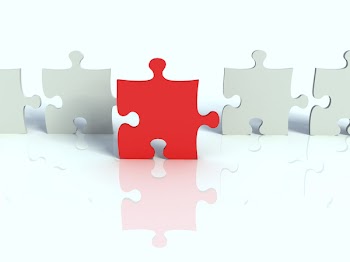 A red piece of a jigsaw puzzle