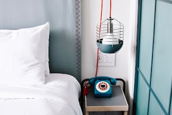 A Retro Telephone On  The Bedside Table