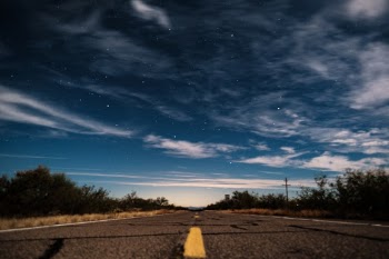 A road in Tucson on a cloudy night