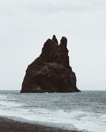 A Rock Formation On The Sea Close To The Shore