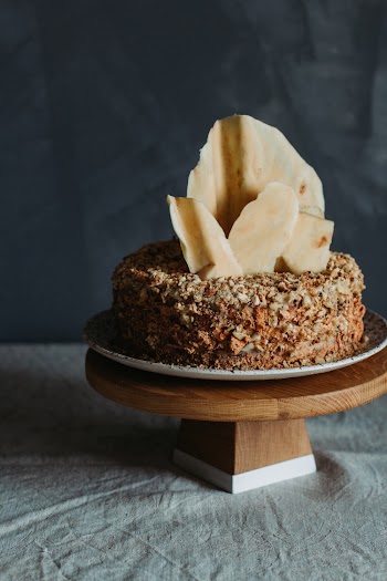 A Round Brown and White Cake On Top Of A Table