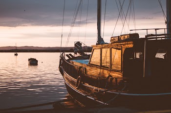 A sailing boat at sunset