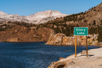 A Signage Of Ellery Lake By The Bank Surrounded By The View Of The Mountains