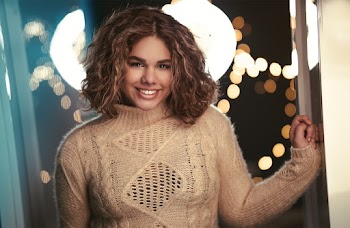 A Smiling Woman Wearing Knitted Sweater