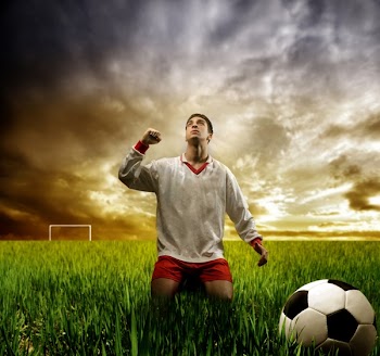 a soccer player on the grass field
