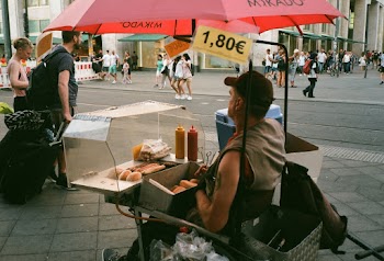 A Street Vendor Watching The People