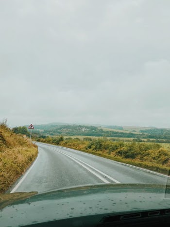 A Vehicle Driving on a Countryside Road · Free Stock Photo