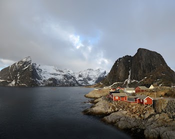 A Village By The Lake Beside Mountain