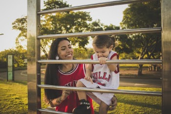 A Woman and a Child Wearing Chicago Bulls Jersey