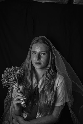 A Woman holding a Wedding Bouquet