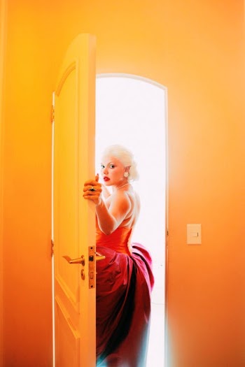 A Woman in a Backless Dress Going Outside a Room · Free Stock Photo