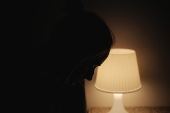 A woman in lamplight 2