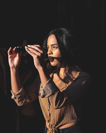 A Woman Look's On Her Sunglasses