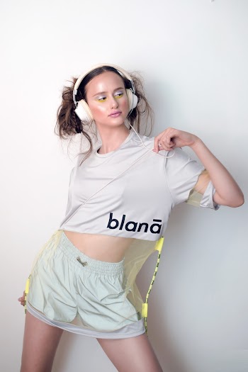 A Woman Posing Wearing A Head Phone 