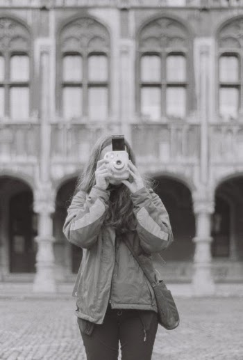 A Woman Using a Polaroid Camera · Free Stock Photo