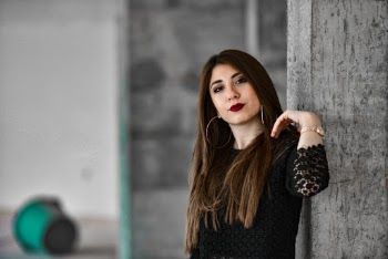 A woman wearing a black top