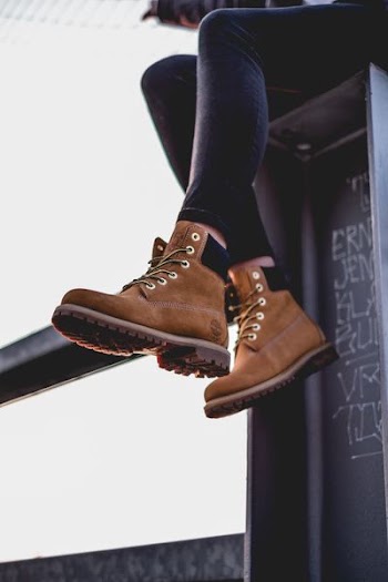 A woman wearing Timberland boots