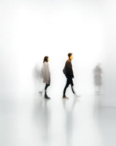 Abstract Motion: Blurred Figures on White Background Abstract Motion: Blurred Figures on White Background
