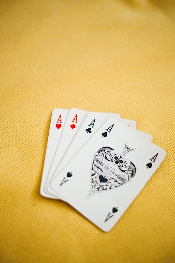 Ace Playing Cards on Brown Textile