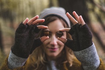 Acorns Held In Front Of Eyes