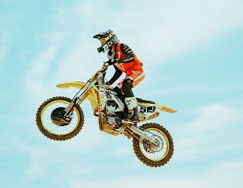 Action-Packed Motocross Rider in Midair