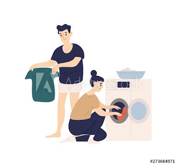 Adorable funny couple sorting clothes and putting it in washing machine