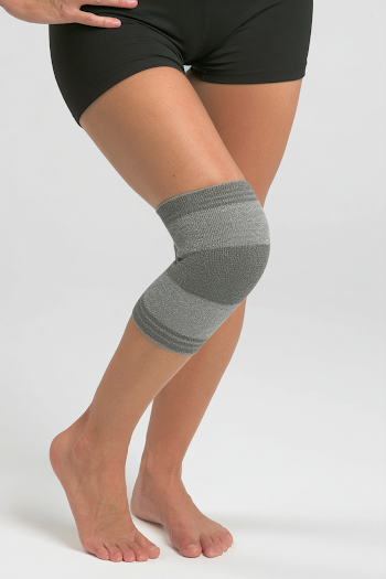 Adult Leg with Knee Compression Sleeve in Studio Setting