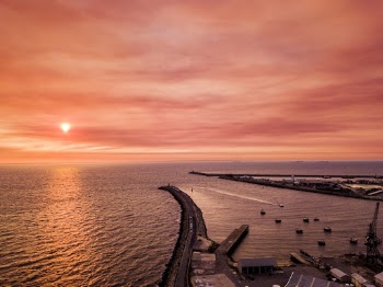 Aerial Photo of Boats on Dock During Golden Hour