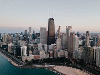 aerial photo of buildings near body of water at daytime