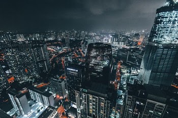 aerial photo of city buildings during night time