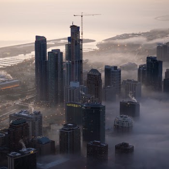 Aerial Photo of Cityscape Covered in Fog