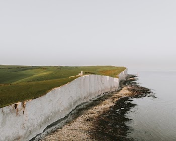 Aerial Photo of Cliff Near Seashore