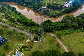 Aerial Photo Of Electric Tower Near Creek
