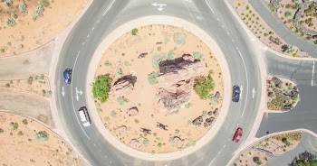 Aerial Photo of Four Cars on round about at Daytime