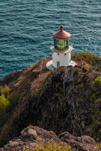 Aerial Photo of Lighthouse at Top of Cliff