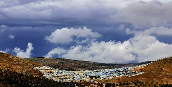 Aerial Photo of Mountain and City
