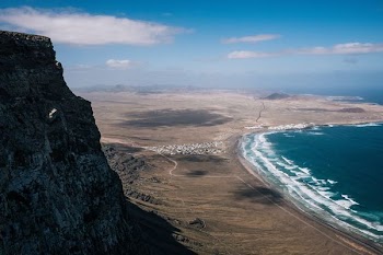 aerial photo of ocean in front mountain