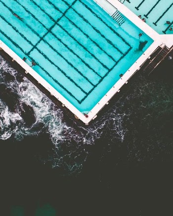 aerial photo of pool near beach