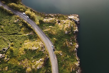 Aerial Photo of Road Beside Body of Water